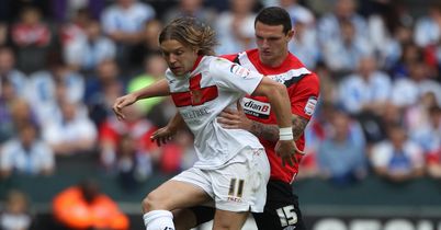 Tense: Alan Smith holds off Sean Morrison